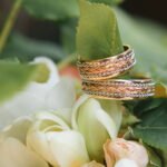wedding rings on flowers bouquet